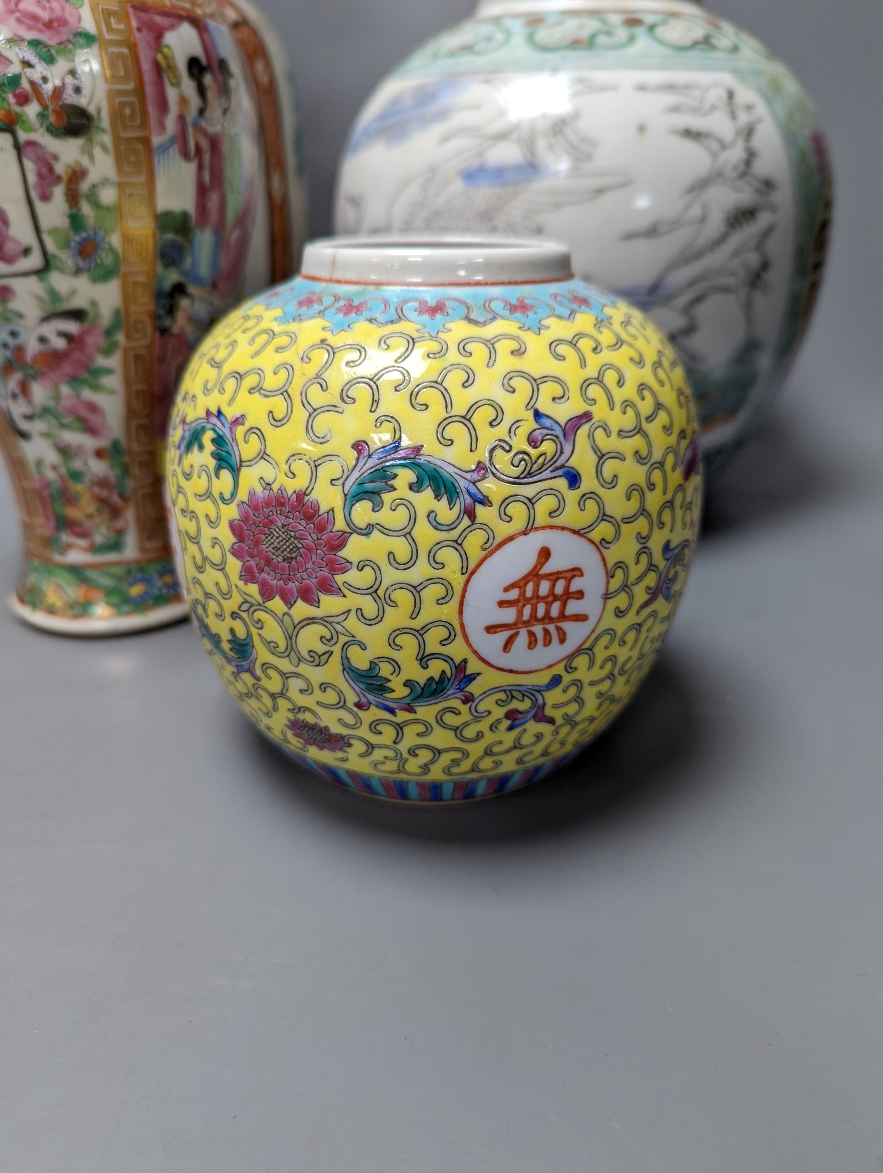 A Chinese famille rose vase and two ginger jars, together with a Japanese vase, 38cm